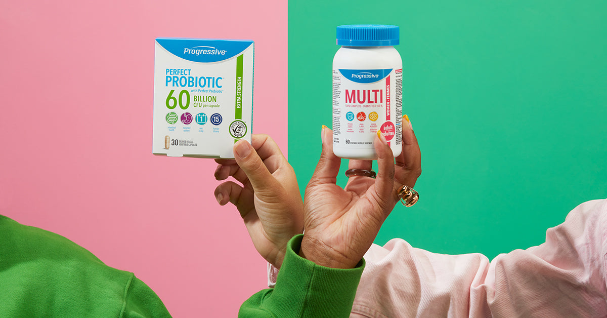 hands holding multivitamin and probiotic products