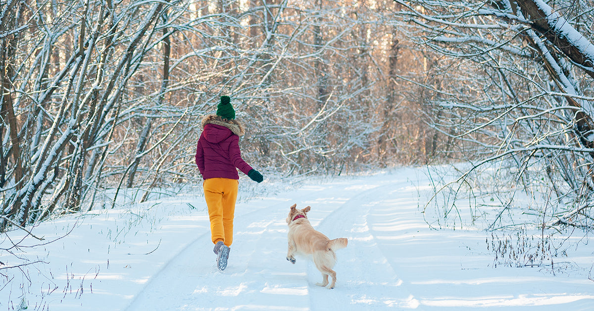 woman and dog running