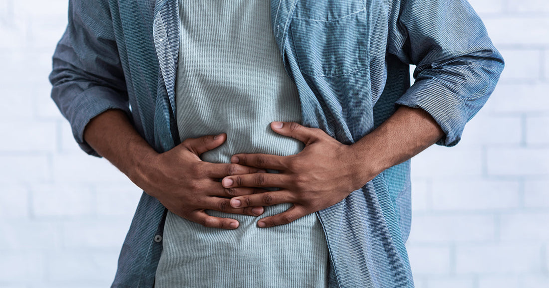 man holding his stomach