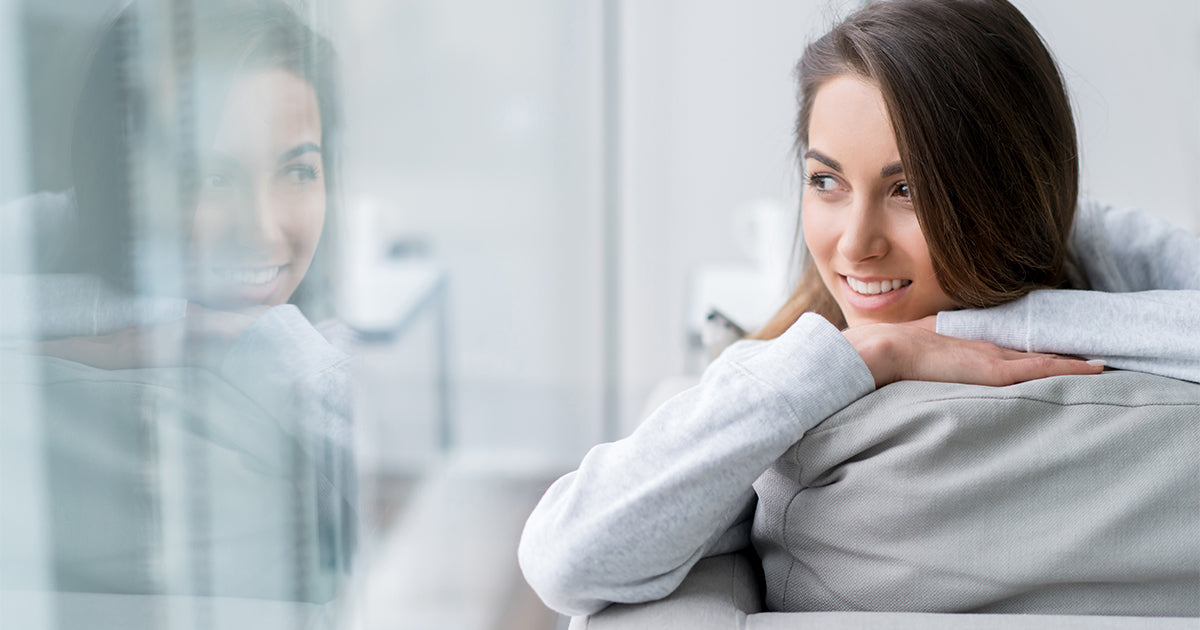 woman looking out window